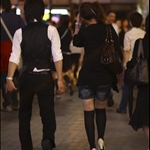Hot chick followed by a guy!