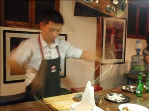 The expert chef makes a long noodle