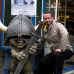 Simon looks confused and embarrassed by his new Viking friend