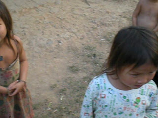 Playing with kids (and egging them on from off camera) while we wait for someone to get us some petrol after we ran out near Luang Nam Tha