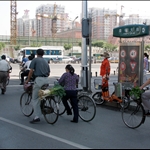Morning traffic in Beijing, the guy in the front was chassing after his ranaway bike. Tons of hotels were under construction for the olympics. (day 2, Beijing)