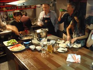 Sophia demonstrates while her audience turn to drink