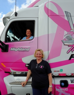 What would a show be without the presence of these two ladies? That's Joanne Millen in her truck with a smiley Anne Finley standing