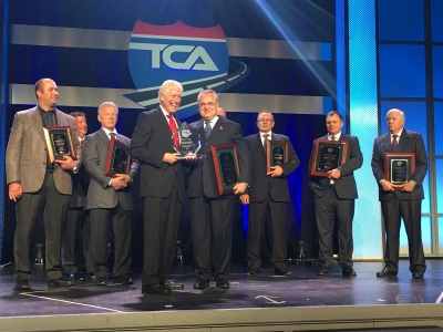 Bison's Garth Pitzel accepts award at TCA's Awards banquet - Photo Courtesy of Truck News