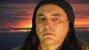 Video Grab of Filmmaker/Performer Donald Morin, Sunset added thru green screen technology