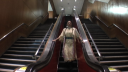 Synopsis: An installation/time-loop format self-portrait of the artist
on the Brooklyn library escalator. Link to: self-portrait in alterNation between descension & ascension