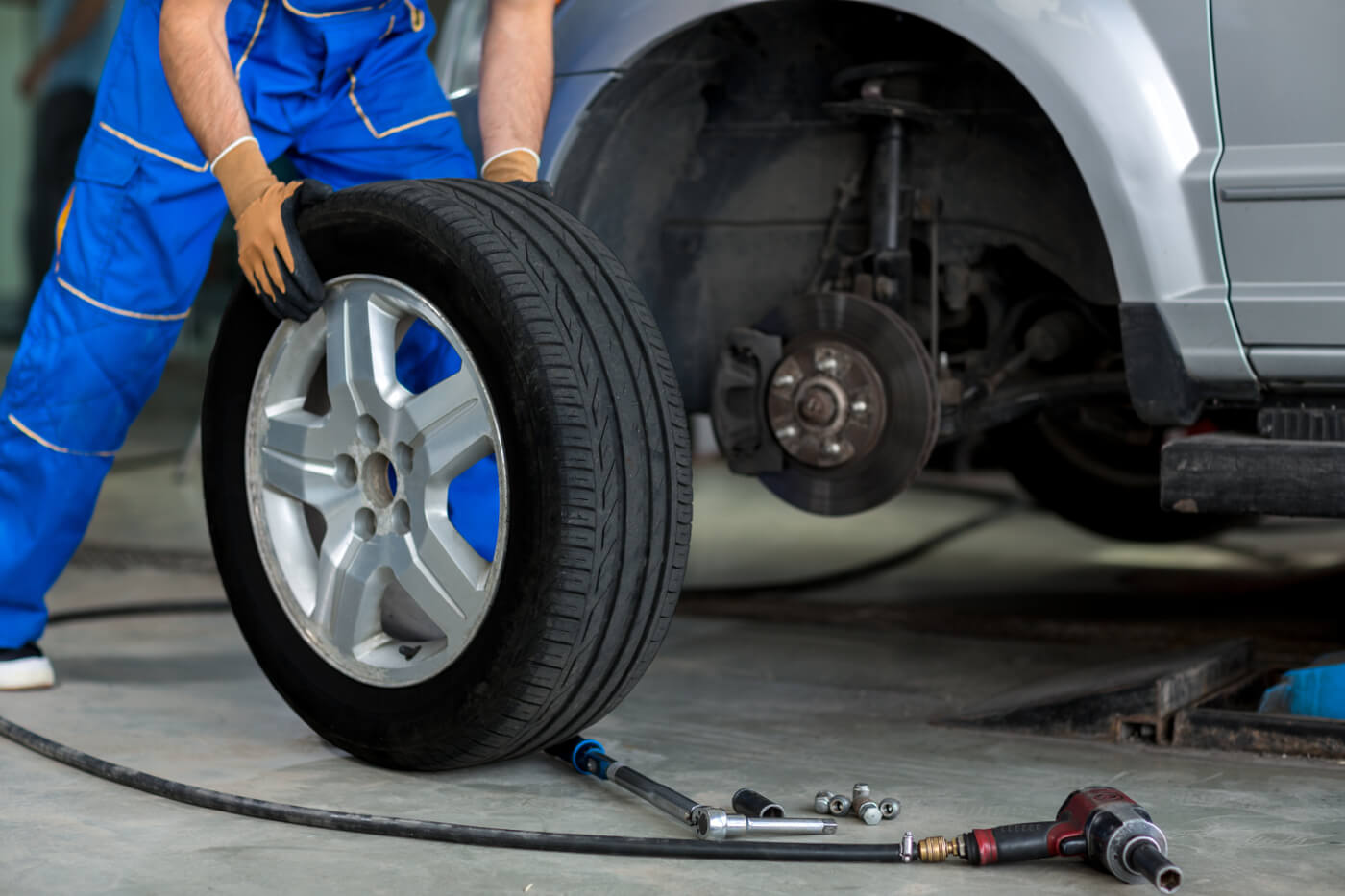 mechanic replacing a tire