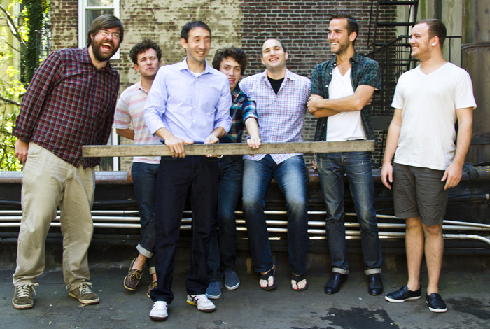 The men. We can't explain the stick, or why they're so happy about it.