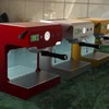 Robot-controlled espresso machine.