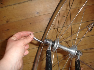 A quick release lever on a front wheel