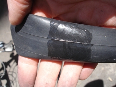 Apply rubber solution over an area a little larger than the patch