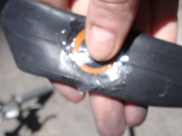 Squeeze the patch into the rubber solution on the tube