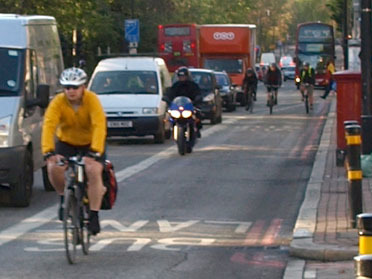 Motorbike and cycle in Brixton Hill bus lane