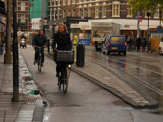 Cycle lane integrated with bus stop