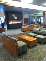 Fireplace Lounge showing large fireplace, easy chairs, and coffee tables