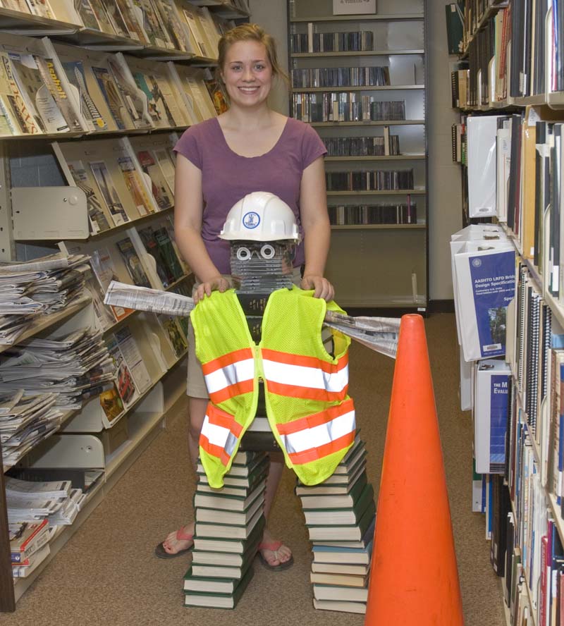 Image shows Emma Whittington with her creation "library guy" during National Library Week in 2010.