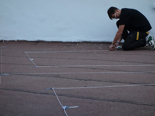 James Bridle preparing the large-scale Drone Shadow drawing in Istanbul, 2012. Image courtesy of the artist