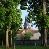 View through avenue to church