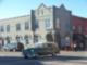 Antique car on Broadway seen in front of one of the many historic buildings