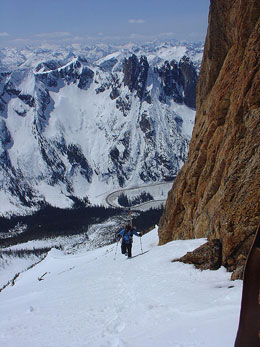 A lone hiker presses forward on his long journey up the mountain.