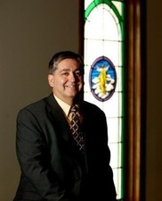 Dr__Perkins_in_Chapel_medium_small.jpg (182x225)px
