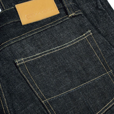 Check out these John Graham Mellor Slim Straight Jeans made in San Francisco, CA by Tellason. Purchase to support well crafted, raw selvage denim and 2 American workers. Gets you 3080 Boom™ Points.
