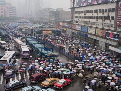 Fine Art Print of Sea of Umbrellas in Shanghai Railway Station by Assaf Frank