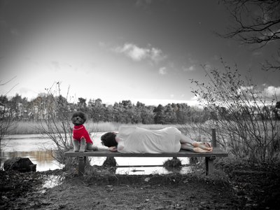 Fine Art Print of Man lying down on bench by lake, rear view (B&amp;W) by Assaf Frank