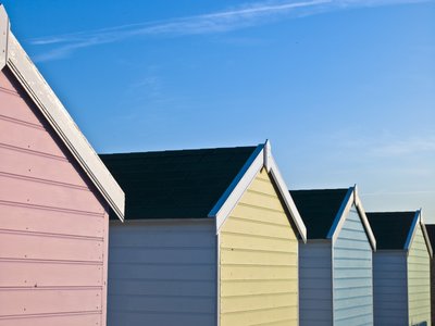 Fine Art Print of Beach huts in a row, close-up by Assaf Frank