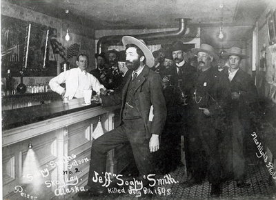 'Soapy' Smith's Saloon Bar at Skagway, Alaska, 1898 (b/w photo) by American Photographer - print
