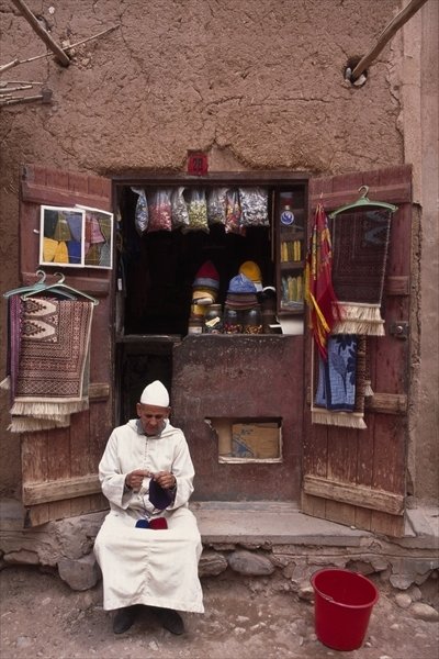 Fine Art Print of Vendor knitting, Taouit by Anonymous