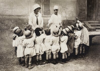 Fine Art Print of Orphans and refugee children being given pieces of chocolate at the Chateau de Grand-Val in Sucy-en-Brie, France during the First World War, from 'L'Illustration', published in 1918 by French School