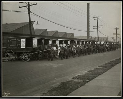 Fine Art Print of Horsedrawn delivery wagons parked outside the Carolyn Laundry at 111 East 128th Street, East Harlem, New York, 1929 by Byron Company