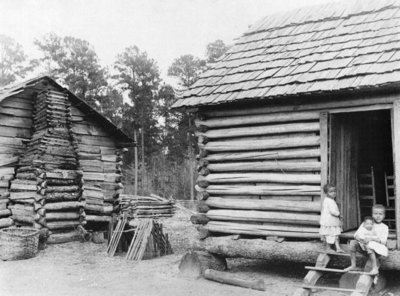 Log cabins in Thomasville, Florida, c.1900 (b/w photo) by American Photographer - print