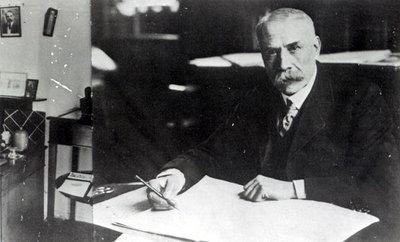 Sir Edward Elgar (1857-1934) at work on one of his orchestral scores (b/w photo) by English Photographer - print