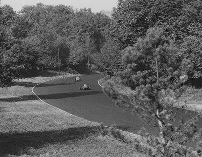 1961 Italian GP, Monza, Stirling Moss, Lotus 21-Climax, leads Dan Gurney, Porsche 718. Gurney finished 2nd position by Anonymous - print