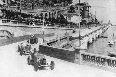 1929 Monaco Grand Prix. Monte Carlo, Monaco. 14 April 1929. ""Georges Philippe"" (real name Baron de Rothschild, Bugatti T35C) leads Rudolf Caracciola (Mercedes-Benz SSK) in Tabac corner. They finished in 4th and 3rd positions respectively. by Anonymous - print