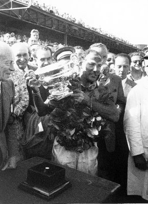 1955 British Grand PrixAintree, Great Britain. 1955Race winner Stirling Moss (Mercedes Benz W196), podium. by Anonymous - print