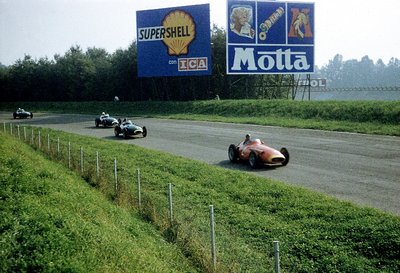 1957 Italian Grand Prix. Monza, Italy. 6-8 September 1957. Juan Manuel Fangio (Maserati 250F) leads Tony Brooks and Stirling Moss (both Vanwall's). by Anonymous - print