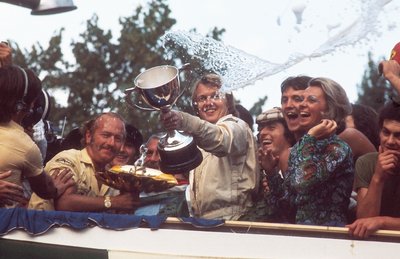 1973 Italian Grand Prix. Monza, Italy. 7-9 September 1973. Ronnie Peterson (Lotus Ford) celebrates 1st position on the podium with team boss Colin Chapman. by Anonymous - print