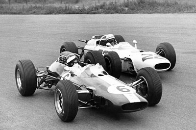 1965 Dutch Grand Prix. Zandvoort, Holland. 18 July 1965. Jim Clark, Lotus 33-Climax, 1st position, leads Richie Ginther, Honda RA272, 6th position, action. by Anonymous - print