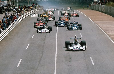 1975 South African Grand Prix. Kyalami, South Africa. 27/2-1/3 1975. Carlos Pace leads Carlos Reutemann (both Brabham BT44B Ford's), Jody Scheckter and Patrick Depailler (both Tyrrell 007 Ford's) and Niki Lauda (Ferrari 312T) at the start, action. by Anonymous - print