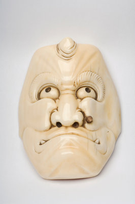 Carved ivory okimono in the shape of a face by Unknown - print