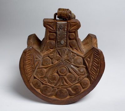 Large, decoratively carved wooden stirrup by Unknown - print