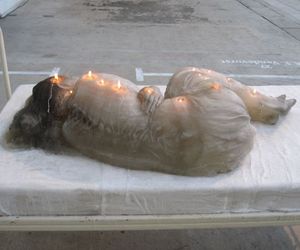 A Wax Woman Sculpture Can be Used as a Candle