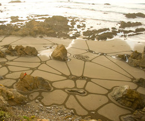 Beach sand sculpture by Andres Amador
