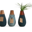 Drop-shaped-vase-made-from-recycled-paper-and-offcut-wood-s