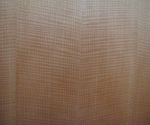 Highly-figured-bookmatched-anigre-veneer-in-custom-cabinetry-m