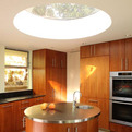 Round-stainless-steel-topped-kitchen-island-round-skylight-s