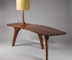 Unique-table-with-three-legs-and-a-beautiful-lamp-m